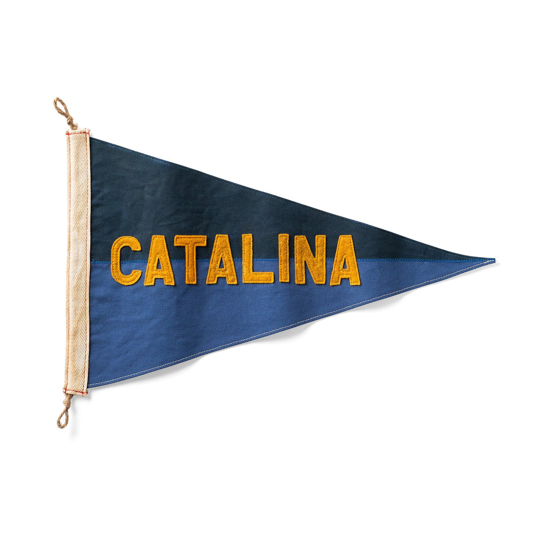 Blue triangular flag with 'Catalina' in yellow on a white background