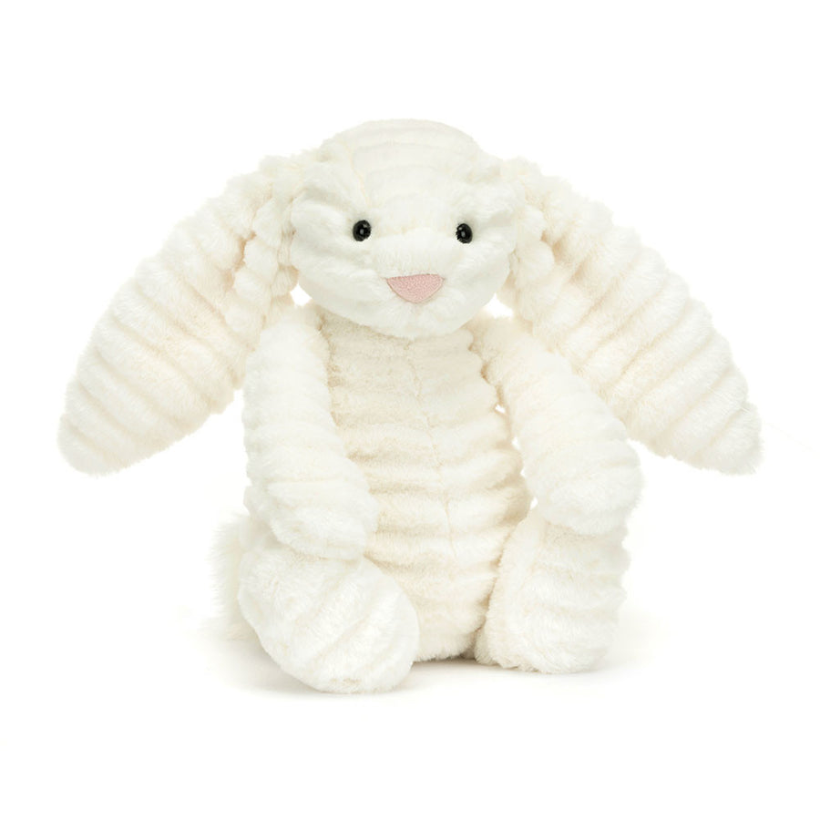 White plush bunny toy on a white background