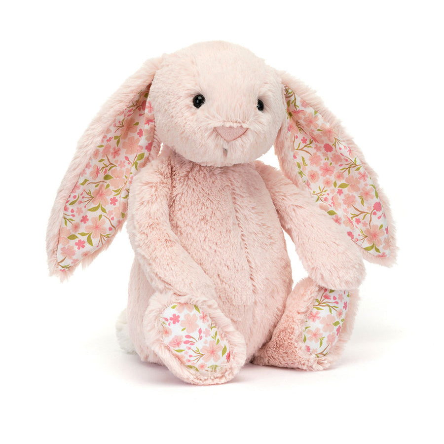 Floral-patterned plush bunny toy on a white background