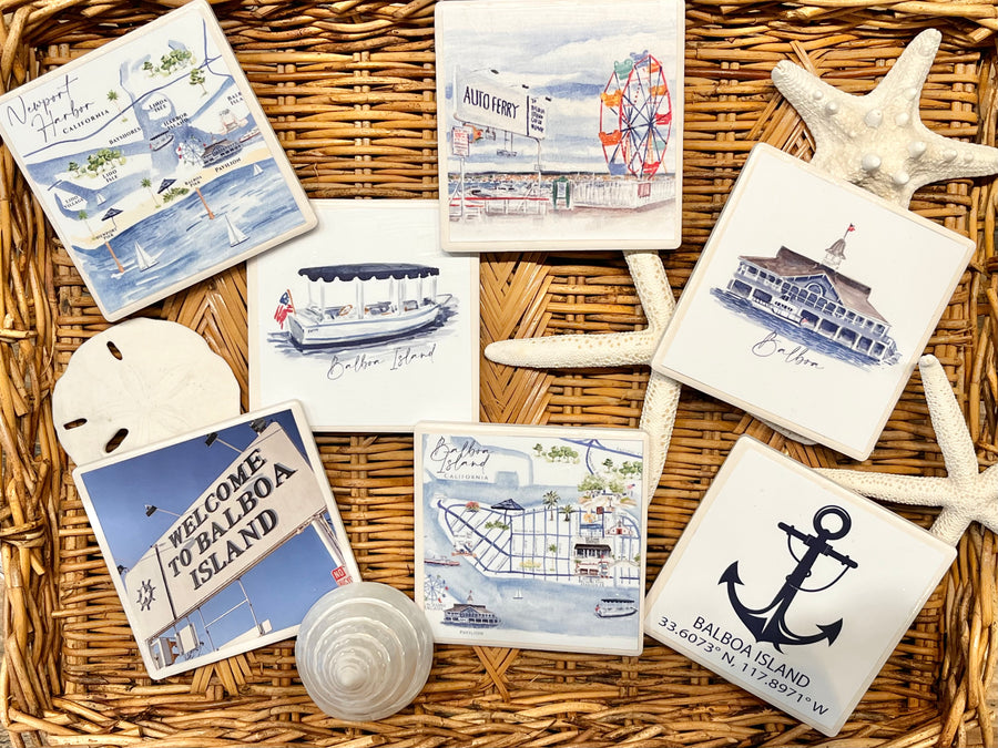 Set of coastal-themed coasters with illustrations on a woven surface