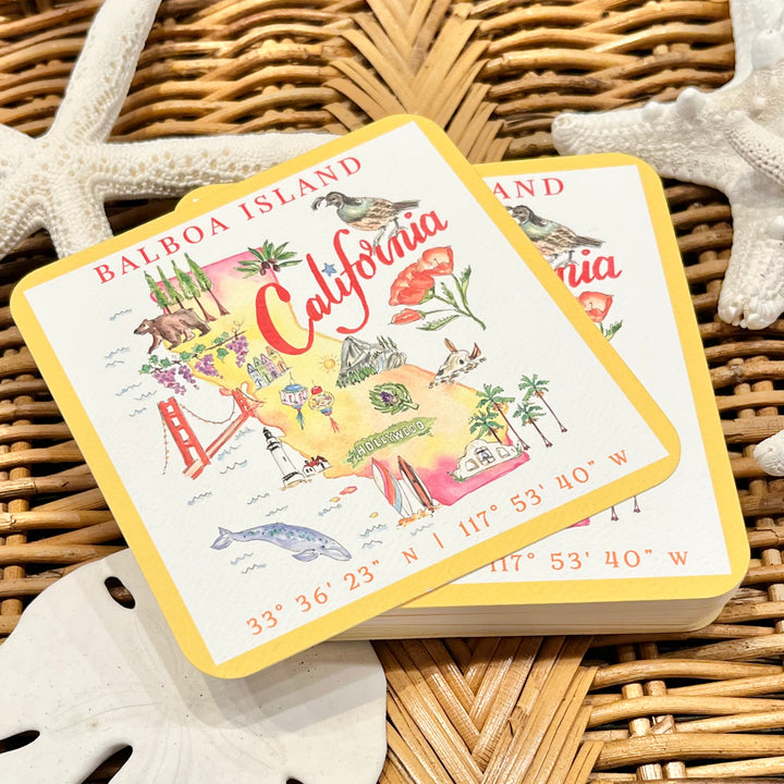 Coaster set with California-themed design on a woven surface