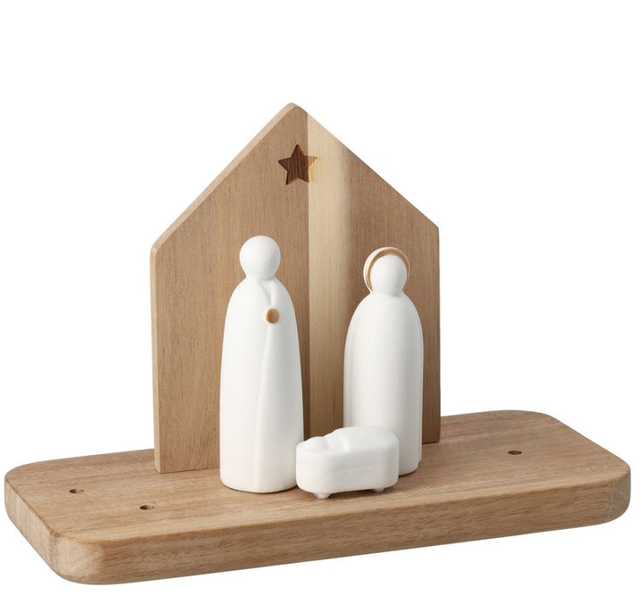 Wooden nativity scene with white figures on a white background