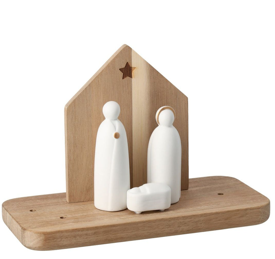 Wooden nativity scene with white figures on a white background