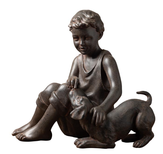 seated boy with dog in resin