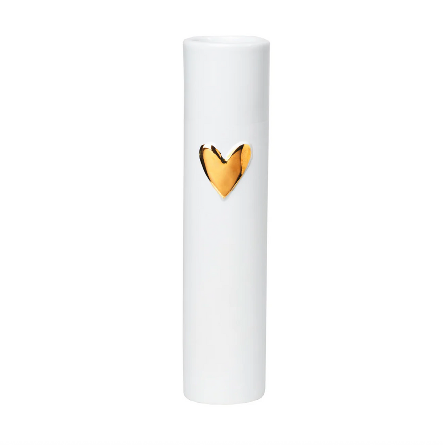 White cylindrical product with a gold heart-shaped emblem on a white background