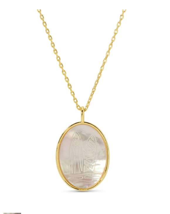 Gold necklace with an oval pendant on a white background