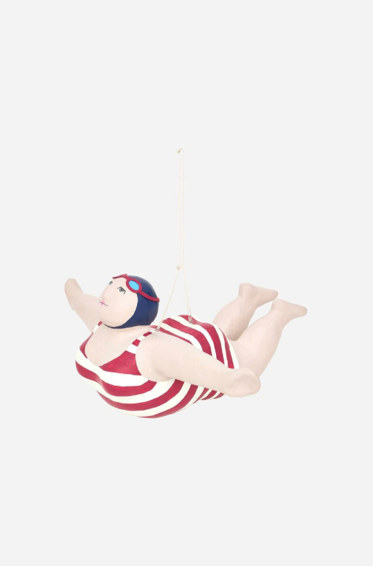 Decorative figurine of a person in a swimsuit with a helmet on a white background