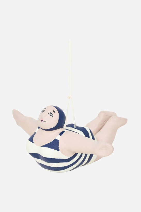 Decorative figure of a woman in a swimsuit hanging on a white background