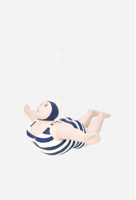 Decorative figure of a woman in a swimsuit on a white background